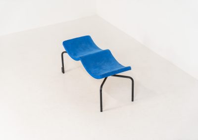 Rare “Sea” bench by Rud Thygesen & Johnny Sørensen for Magnus Olesen (Denmark, 1980s). A beautiful two-seater bench consisting of a black metal frame paired with a wavy seat upholstered in a blue fabric That adds a bold yet refined accent. The bench remains in very good condition and is marked by maker.