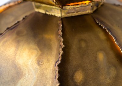 Flower-shaped pendant light by Svend Aage Holm Sørensen (Denmark, 1960s). An exceptional Brutalist pendant, crafted from layered, flame-cut and acid-treated brass slats. The sculptural construction creates a striking interplay of light and shadow, while the beautifully developed patina enhances its raw, organic character. A true eye-catcher with strong presence. In original, well-preserved condition. Marked by the maker.