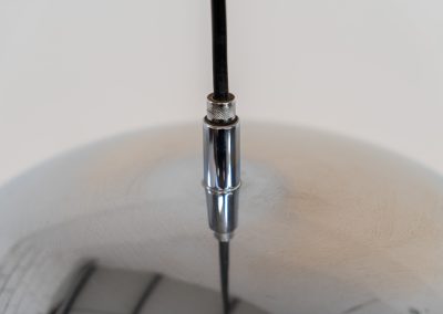 Chrome pendel by Richard Carruters for Ateljé Lyktan (Sweden, 1970s). A sleek and contemporary lamp that perfectly captures the space-age aesthetic of the mid-century era. The high-gloss chrome finish creates a striking mirror effect, reflecting the surrounding interior, while the wide, shallow dome provides a focused yet warm downward glow. The lamp is in amazing condition with some age related wear on the the chrome and the inside lacquer.