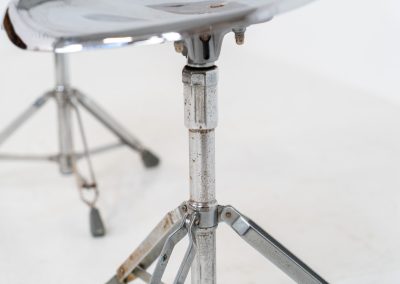 Rare pair of Dulton stools by Yasu Satamoto for Dulton Co. (Japan, 1970s). A striking and unconventional pair of chrome stools designed by experimental Japanese designer Yasu Satamoto for Dulton Co. The concept is both playful and industrial: a sculptural tractor seat mounted onto a drummer’s stool base, executed in stainless steel. The stools are easily foldable and collapsible, making them practical as well as visually distinctive. They remain in good vintage condition, showing a beautiful patina with light, age-related rust marks. We have chosen to preserve this finish to enhance their authentic character, but they can of course be polished and the rust removed upon request.