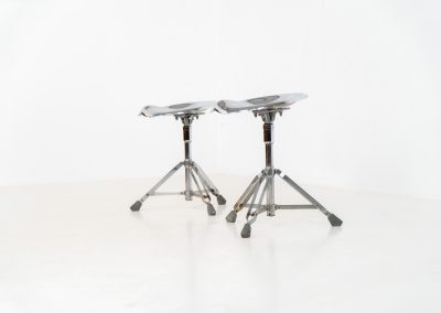 Rare pair of Dulton stools by Yasu Satamoto for Dulton Co. (Japan, 1970s). A striking and unconventional pair of chrome stools designed by experimental Japanese designer Yasu Satamoto for Dulton Co. The concept is both playful and industrial: a sculptural tractor seat mounted onto a drummer’s stool base, executed in stainless steel. The stools are easily foldable and collapsible, making them practical as well as visually distinctive. They remain in good vintage condition, showing a beautiful patina with light, age-related rust marks. We have chosen to preserve this finish to enhance their authentic character, but they can of course be polished and the rust removed upon request.