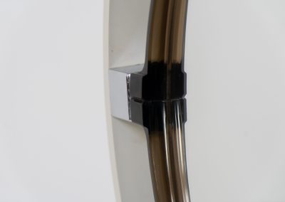 Model A41 backlit wall mirror by Allibert (Germany, 1970s). A striking space age design by Allibert, Germany. This Model A41 mirror is crafted from molded plastic and designed to hold four E14 bulbs inside, operated by a pull switch on the side. When illuminated, the translucent plastic frame softly diffuses the light, creating a warm halo effect around the mirror glass. The mirror can be tilted up or down, adding both functionality and a sculptural presence to the piece. Presented in good vintage condition with light, age-appropriate wear.