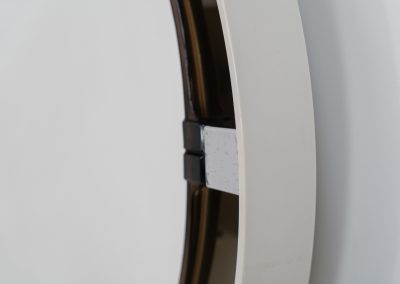 Model A41 backlit wall mirror by Allibert (Germany, 1970s). A striking space age design by Allibert, Germany. This Model A41 mirror is crafted from molded plastic and designed to hold four E14 bulbs inside, operated by a pull switch on the side. When illuminated, the translucent plastic frame softly diffuses the light, creating a warm halo effect around the mirror glass. The mirror can be tilted up or down, adding both functionality and a sculptural presence to the piece. Presented in good vintage condition with light, age-appropriate wear.