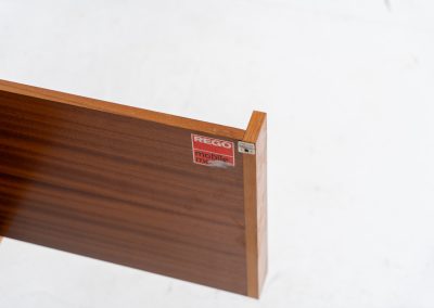 Minimalist cabinet by Gunter Renkel for Rego (Germany, 1960s). Crafted in warm teak, the cabinet features clean architectural lines, two doors, and a beautifully balanced composition. The slender black metal legs create a subtle contrast and give the piece a light, elevated appearance. Compact yet versatile, it works perfectly as a low sideboard, media cabinet, or storage unit in both modern and mid-century interiors. Its in very good vintage condition. Make sure to check out the dimensions as it’s slightly deeper than your average cabinet.