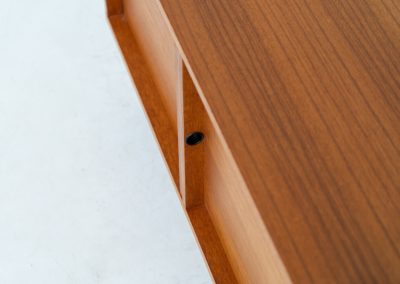 Minimalist cabinet by Gunter Renkel for Rego (Germany, 1960s). Crafted in warm teak, the cabinet features clean architectural lines, two doors, and a beautifully balanced composition. The slender black metal legs create a subtle contrast and give the piece a light, elevated appearance. Compact yet versatile, it works perfectly as a low sideboard, media cabinet, or storage unit in both modern and mid-century interiors. Its in very good vintage condition. Make sure to check out the dimensions as it’s slightly deeper than your average cabinet.