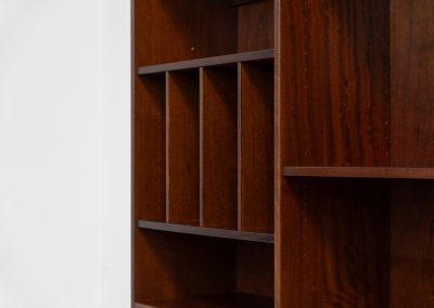 Rosewood bookcase by Aejm Møbler (Denmark, 1960s). Minimalist Danish bookcase crafted in richly grained rosewood. The design is clean and architectural, with well-balanced proportions and a strong vertical rhythm. The cabinet features fixed shelves and four integrated record dividers, making it ideal for vinyl storage while still offering versatile display space. A well-built and functional piece with the original maker's label intact. Presented in good vintage condition with only light, age-appropriate wear.