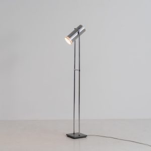 Trombone floorlamp by Jo Hammerborg for Fog & Mørup (Denmark, 1960s). This stunning lamp is made out of a square metal base, 2 chrome rods and a tubular aluminium shade perforated with elongated slots on top and below. This one is an early production in good vintage condition with visible using traces on and inside the shade.