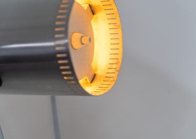 Trombone floorlamp by Jo Hammerborg for Fog & Mørup (Denmark, 1960s). This stunning lamp is made out of a square metal base, 2 chrome rods and a tubular aluminium shade perforated with elongated slots on top and below. This one is an early production in good vintage condition with visible using traces on and inside the shade.