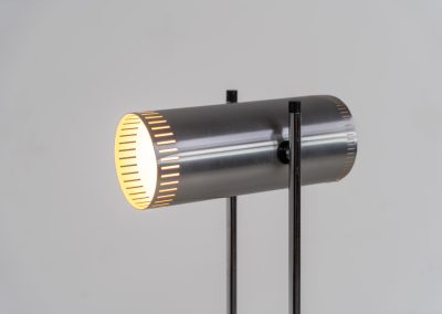 Trombone floorlamp by Jo Hammerborg for Fog & Mørup (Denmark, 1960s). This stunning lamp is made out of a square metal base, 2 chrome rods and a tubular aluminium shade perforated with elongated slots on top and below. This one is an early production in good vintage condition with visible using traces on and inside the shade.