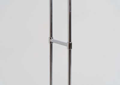 Trombone floorlamp by Jo Hammerborg for Fog & Mørup (Denmark, 1960s). This stunning lamp is made out of a square metal base, 2 chrome rods and a tubular aluminium shade perforated with elongated slots on top and below. This one is an early production in good vintage condition with visible using traces on and inside the shade.