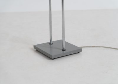 Trombone floorlamp by Jo Hammerborg for Fog & Mørup (Denmark, 1960s). This stunning lamp is made out of a square metal base, 2 chrome rods and a tubular aluminium shade perforated with elongated slots on top and below. This one is an early production in good vintage condition with visible using traces on and inside the shade.