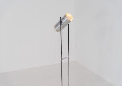 Trombone floorlamp by Jo Hammerborg for Fog & Mørup (Denmark, 1960s). This stunning lamp is made out of a square metal base, 2 chrome rods and a tubular aluminium shade perforated with elongated slots on top and below. This one is an early production in good vintage condition with visible using traces on and inside the shade.