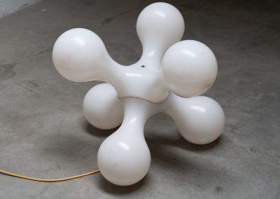 Atomium floor lamp by Benjamin Hopf & Constantin Wortmann for Kundalini (Italy, 1990s). Inspired by the iconic Atomium in Brussels, this striking lamp features a molded plastic structure with six internal light sources, creating a warm and atmospheric glow. The piece is versatile and can be used both as a floor lamp or as a large pendant light. It remains in good vintage condition, with visible signs of use including scratches and some purple marks that could not be removed.