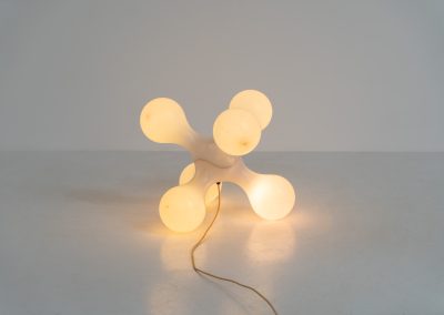 Atomium floor lamp by Benjamin Hopf & Constantin Wortmann for Kundalini (Italy, 1990s). Inspired by the iconic Atomium in Brussels, this striking lamp features a molded plastic structure with six internal light sources, creating a warm and atmospheric glow. The piece is versatile and can be used both as a floor lamp or as a large pendant light. It remains in good vintage condition, with visible signs of use including scratches and some purple marks that could not be removed.