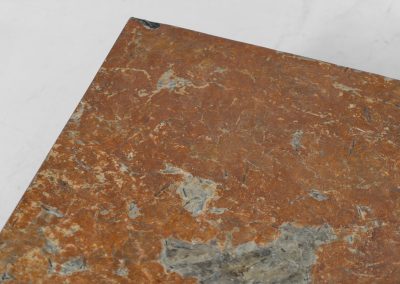 Brutalist Coffee Table in Norwegian Slate stone, 1970s A very powerful Brutalist coffee table from the 1970s, defined by its strong architectural presence and sculptural simplicity. The substantial tabletop is crafted from Norwegian slate, showcasing a rich and varied surface with natural tonal shifts that create depth and visual texture. The solid stone top is supported by a black lacquered metal base, offering a bold contrast while reinforcing the table’s grounded and monolithic character. The table remains in very good condition, with light, age-appropriate wear such as minor scratches to the frame.