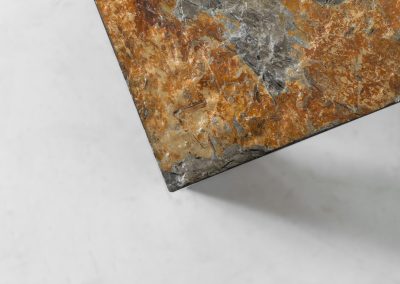 Brutalist Coffee Table in Norwegian Slate stone, 1970s A very powerful Brutalist coffee table from the 1970s, defined by its strong architectural presence and sculptural simplicity. The substantial tabletop is crafted from Norwegian slate, showcasing a rich and varied surface with natural tonal shifts that create depth and visual texture. The solid stone top is supported by a black lacquered metal base, offering a bold contrast while reinforcing the table’s grounded and monolithic character. The table remains in very good condition, with light, age-appropriate wear such as minor scratches to the frame.