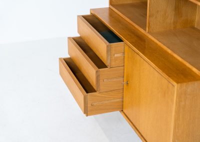 Bookcase by Marianne Grabinski for Ikea (Sweden, 1960s). This two-piece bookcase was designed by Marianne Grabinski for IKEA, back when the company was still exclusively based in Sweden. It is crafted from oak and offers generous storage space, featuring four adjustable shelves, three drawers, and a cabinet with a functional lock. The bookcase is in very good condition, showing only minor signs of age and use.