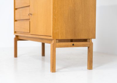Bookcase by Marianne Grabinski for Ikea (Sweden, 1960s). This two-piece bookcase was designed by Marianne Grabinski for IKEA, back when the company was still exclusively based in Sweden. It is crafted from oak and offers generous storage space, featuring four adjustable shelves, three drawers, and a cabinet with a functional lock. The bookcase is in very good condition, showing only minor signs of age and use.