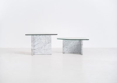Marble & glass coffee tables (Italy, 1970s). A striking pair of coffee tables that perfectly balance weight and lightness. Each piece features a sculptural marble base with elegant veining, contrasted by a floating glass top that enhances the clean, architectural lines. The asymmetrical forms give the set a playful yet refined presence, making them ideal as a duo or used separately. Both tables are in very good condition.