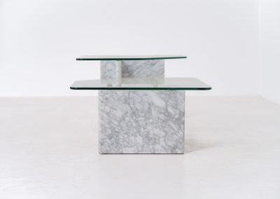 Marble & glass coffee tables (Italy, 1970s). A striking pair of coffee tables that perfectly balance weight and lightness. Each piece features a sculptural marble base with elegant veining, contrasted by a floating glass top that enhances the clean, architectural lines. The asymmetrical forms give the set a playful yet refined presence, making them ideal as a duo or used separately. Both tables are in very good condition.
