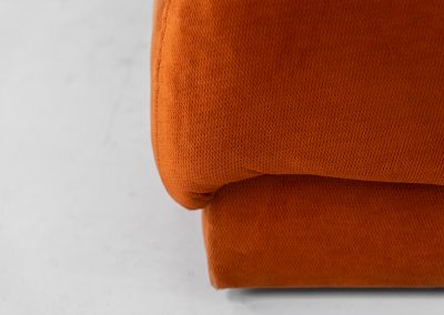 Modular sofa by Doimo Salotti (Italy, 1970s). Striking and bold modular seating system consisting of three identical elements and one corner piece, upholstered in their original vivid orange velvet. Can be arranged as a sofa or used as individual lounge chairs. Low, sculptural design with generous padding, offering both strong visual impact and excellent comfort. Professionally deep-cleaned and in very good original condition, with minor age-related wear. Some cracks to the underside dust covers (purely cosmetic, no impact on use or structure). Marked by maker.
