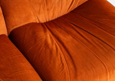 Modular sofa by Doimo Salotti (Italy, 1970s). Striking and bold modular seating system consisting of three identical elements and one corner piece, upholstered in their original vivid orange velvet. Can be arranged as a sofa or used as individual lounge chairs. Low, sculptural design with generous padding, offering both strong visual impact and excellent comfort. Professionally deep-cleaned and in very good original condition, with minor age-related wear. Some cracks to the underside dust covers (purely cosmetic, no impact on use or structure). Marked by maker.