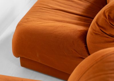 Modular sofa by Doimo Salotti (Italy, 1970s). Striking and bold modular seating system consisting of three identical elements and one corner piece, upholstered in their original vivid orange velvet. Can be arranged as a sofa or used as individual lounge chairs. Low, sculptural design with generous padding, offering both strong visual impact and excellent comfort. Professionally deep-cleaned and in very good original condition, with minor age-related wear. Some cracks to the underside dust covers (purely cosmetic, no impact on use or structure). Marked by maker.