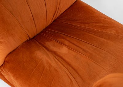 Modular sofa by Doimo Salotti (Italy, 1970s). Striking and bold modular seating system consisting of three identical elements and one corner piece, upholstered in their original vivid orange velvet. Can be arranged as a sofa or used as individual lounge chairs. Low, sculptural design with generous padding, offering both strong visual impact and excellent comfort. Professionally deep-cleaned and in very good original condition, with minor age-related wear. Some cracks to the underside dust covers (purely cosmetic, no impact on use or structure). Marked by maker.