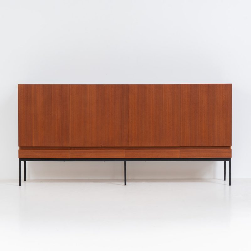 Iconic B60 sideboard by Dieter Waeckerlin for Behr (Germany, 1950s). This highly sought after and significant “B60” sideboard is a masterful blend of minimalistic design and functional elegance. It’s unbelievable this piece was made in the 50’s and is yet so timeless. It contains four drawers and four doors with a minimal gap between them. The inside offers lots of storage space with adjustable shelves. It is in amazing condition with minor sings of use and age.