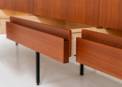Iconic B60 sideboard by Dieter Waeckerlin for Behr (Germany, 1950s). This highly sought after and significant “B60” sideboard is a masterful blend of minimalistic design and functional elegance. It’s unbelievable this piece was made in the 50’s and is yet so timeless. It contains four drawers and four doors with a minimal gap between them. The inside offers lots of storage space with adjustable shelves. It is in amazing condition with minor sings of use and age.