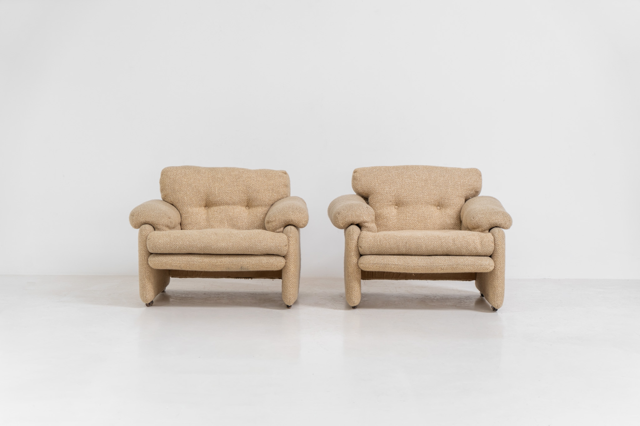 Pair of “Coronado” armchairs by Tobia Scarpa for C&B Italia (Italy, 1970s). These chairs offer a soft, sculptural form and exceptional comfort, upholstered in their original textured wool fabric. Generous proportions and inviting curves make them as comfortable as they are visually striking. In good original condition with some minor using marks. Marked by maker.