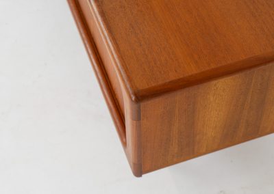 Beautiful lowboard with tambour doors by Svend Dyrlund (Denmark, 1960s). This elegant Danish piece, crafted in teak, features nice organic edges, refined tambour doors, and beautiful solid handles. The back has a factory hole that can be screwed open for cable management, making it a perfect piece for a television or audio gear! This piece is in splendid condition!