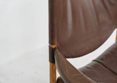 Pair of “Modus” armchairs by Kristian Vedel for Søren Willadsen (Denmark, 1960s). A rare and authentic set of two lounge chairs crafted from solid oak with beautifully detailed joinery. The frames have been carefully refreshed while preserving the wood's original character and warm patina. The brown leather has been cleaned and conditioned, showing attractive age and wear consistent with its vintage nature. A great example of Danish mid-century design, combining elegant sculptural lines with exceptional comfort thanks to the wide seats, suspended leather backs, and generous cushions.