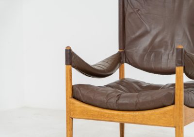 Pair of “Modus” armchairs by Kristian Vedel for Søren Willadsen (Denmark, 1960s). A rare and authentic set of two lounge chairs crafted from solid oak with beautifully detailed joinery. The frames have been carefully refreshed while preserving the wood's original character and warm patina. The brown leather has been cleaned and conditioned, showing attractive age and wear consistent with its vintage nature. A great example of Danish mid-century design, combining elegant sculptural lines with exceptional comfort thanks to the wide seats, suspended leather backs, and generous cushions.