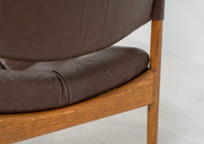 Pair of “Modus” armchairs by Kristian Vedel for Søren Willadsen (Denmark, 1960s). A rare and authentic set of two lounge chairs crafted from solid oak with beautifully detailed joinery. The frames have been carefully refreshed while preserving the wood's original character and warm patina. The brown leather has been cleaned and conditioned, showing attractive age and wear consistent with its vintage nature. A great example of Danish mid-century design, combining elegant sculptural lines with exceptional comfort thanks to the wide seats, suspended leather backs, and generous cushions.