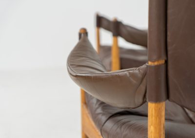 Pair of “Modus” armchairs by Kristian Vedel for Søren Willadsen (Denmark, 1960s). A rare and authentic set of two lounge chairs crafted from solid oak with beautifully detailed joinery. The frames have been carefully refreshed while preserving the wood's original character and warm patina. The brown leather has been cleaned and conditioned, showing attractive age and wear consistent with its vintage nature. A great example of Danish mid-century design, combining elegant sculptural lines with exceptional comfort thanks to the wide seats, suspended leather backs, and generous cushions.