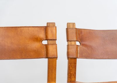Oak & leather dining chairs (Denmark, 1960s). This exceptional set of dining chairs features solid oak frames paired with saddle leather seats. The design is reminiscent of Børge Mogensen’s “Spanish” dining chairs and could possibly be an lesser-known design by Mogensen, although this cannot be confirmed. The leather is in well-used condition with a beautiful, authentic patina. It shows some surface cracking, but this is limited to the top layer only and does not affect the structural integrity or strength of the seats.