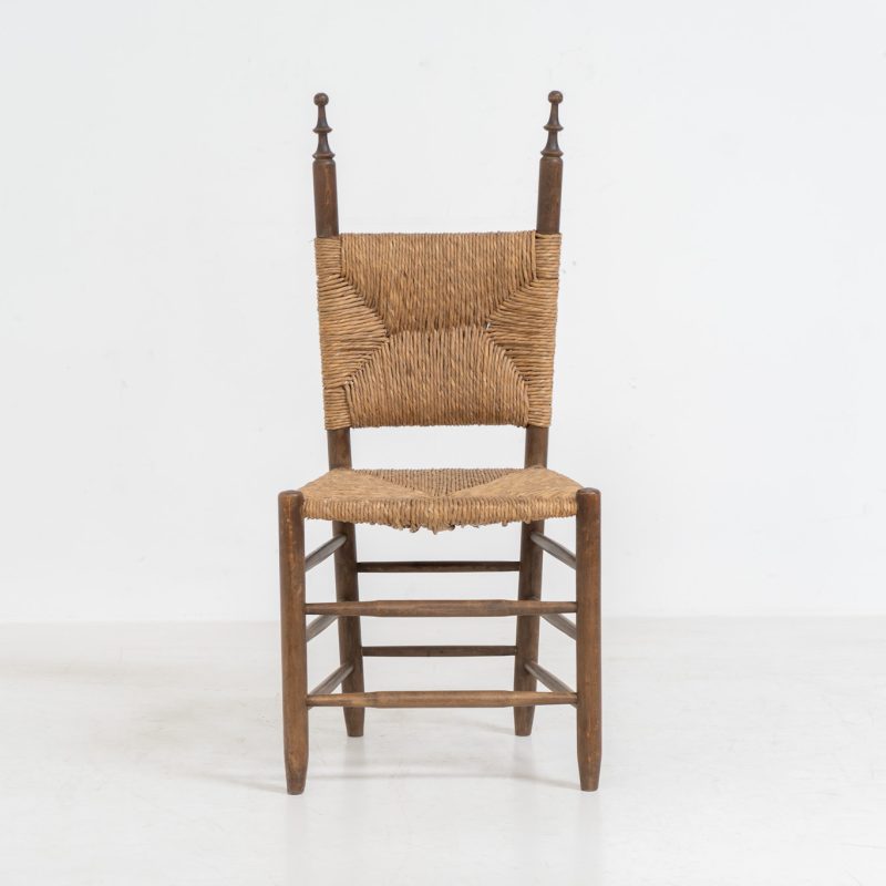 Vintage Spanish side chair, 1950s. This chair features a beautifully sculptural silhouette, crafted from a solid stained beech frame with a handwoven rush seat. Its minimalist yet expressive form adds warmth and texture to any interior. In good condition, with a rich natural patina and visible signs of use that enhance its character.