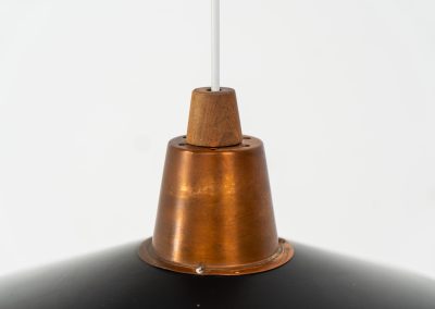 Striking Danish pendant light (Denmark, 1950s). This striking vintage pendant lamp features a refined combination of copper, lacquered metal and teak wood. Its perfectly balanced and sculptural silhouette creates a warm, atmospheric glow while adding a bold design statement to any interior. The lamp is in very good condition with a stunning patina to the copper.