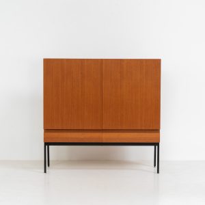 Rare S21 highboard in teak by Dieter Waeckerlin for Behr (Germany, 1950s). Belonging to the same series as the iconic B60, this very hard to find S21 mid sized highboard in teak is a masterful blend of minimalistic design and functional elegance. It’s unbelievable this piece was made in the 50’s and is yet so timeless. It contains two drawers and two doors with a minimal gap between them. The inside offers lots of storage space with adjustable shelves. It is in amazing condition with minimal sings of use and age.