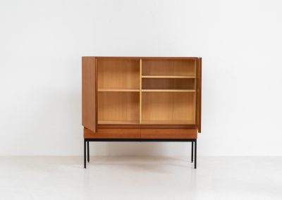 Rare S21 highboard in teak by Dieter Waeckerlin for Behr (Germany, 1950s). Belonging to the same series as the iconic B60, this very hard to find S21 mid sized highboard in teak is a masterful blend of minimalistic design and functional elegance. It’s unbelievable this piece was made in the 50’s and is yet so timeless. It contains two drawers and two doors with a minimal gap between them. The inside offers lots of storage space with adjustable shelves. It is in amazing condition with minimal sings of use and age.