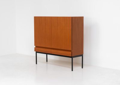 Rare S21 highboard in teak by Dieter Waeckerlin for Behr (Germany, 1950s). Belonging to the same series as the iconic B60, this very hard to find S21 mid sized highboard in teak is a masterful blend of minimalistic design and functional elegance. It’s unbelievable this piece was made in the 50’s and is yet so timeless. It contains two drawers and two doors with a minimal gap between them. The inside offers lots of storage space with adjustable shelves. It is in amazing condition with minimal sings of use and age.