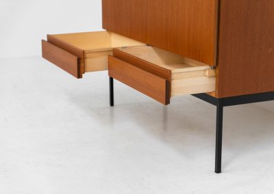 Rare S21 highboard in teak by Dieter Waeckerlin for Behr (Germany, 1950s). Belonging to the same series as the iconic B60, this very hard to find S21 mid sized highboard in teak is a masterful blend of minimalistic design and functional elegance. It’s unbelievable this piece was made in the 50’s and is yet so timeless. It contains two drawers and two doors with a minimal gap between them. The inside offers lots of storage space with adjustable shelves. It is in amazing condition with minimal sings of use and age.