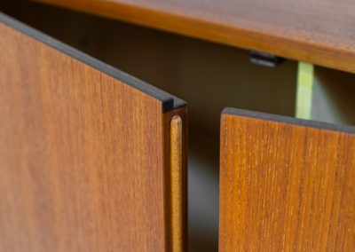 Rare S21 highboard in teak by Dieter Waeckerlin for Behr (Germany, 1950s). Belonging to the same series as the iconic B60, this very hard to find S21 mid sized highboard in teak is a masterful blend of minimalistic design and functional elegance. It’s unbelievable this piece was made in the 50’s and is yet so timeless. It contains two drawers and two doors with a minimal gap between them. The inside offers lots of storage space with adjustable shelves. It is in amazing condition with minimal sings of use and age.