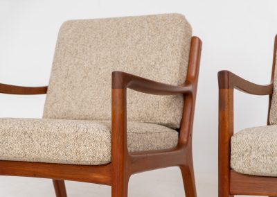 Pair of “Senator” easy chairs by Ole Wanscher for France & Son (Denmark, 1960s). An elegant pair of easy chairs and a fine example of Scandinavian Modernism. They feature a solid teak frame with a warm, natural grain, beautifully sculpted curves, and comfortable cushions upholstered in their original beige wool fabric. The chairs present beautifully and are in mint condition, fully labeled by the maker.
