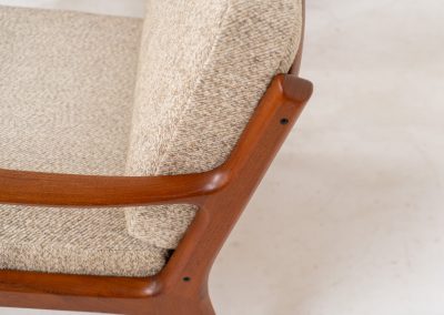 Pair of “Senator” easy chairs by Ole Wanscher for France & Son (Denmark, 1960s). An elegant pair of easy chairs and a fine example of Scandinavian Modernism. They feature a solid teak frame with a warm, natural grain, beautifully sculpted curves, and comfortable cushions upholstered in their original beige wool fabric. The chairs present beautifully and are in mint condition, fully labeled by the maker.