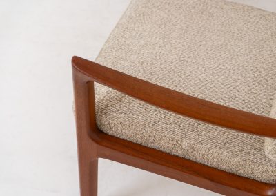 Pair of “Senator” easy chairs by Ole Wanscher for France & Son (Denmark, 1960s). An elegant pair of easy chairs and a fine example of Scandinavian Modernism. They feature a solid teak frame with a warm, natural grain, beautifully sculpted curves, and comfortable cushions upholstered in their original beige wool fabric. The chairs present beautifully and are in mint condition, fully labeled by the maker.