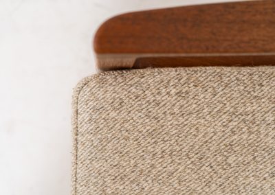 Pair of “Senator” easy chairs by Ole Wanscher for France & Son (Denmark, 1960s). An elegant pair of easy chairs and a fine example of Scandinavian Modernism. They feature a solid teak frame with a warm, natural grain, beautifully sculpted curves, and comfortable cushions upholstered in their original beige wool fabric. The chairs present beautifully and are in mint condition, fully labeled by the maker.
