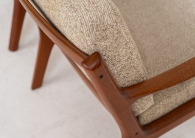 Pair of “Senator” easy chairs by Ole Wanscher for France & Son (Denmark, 1960s). An elegant pair of easy chairs and a fine example of Scandinavian Modernism. They feature a solid teak frame with a warm, natural grain, beautifully sculpted curves, and comfortable cushions upholstered in their original beige wool fabric. The chairs present beautifully and are in mint condition, fully labeled by the maker.