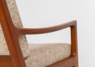 Pair of “Senator” easy chairs by Ole Wanscher for France & Son (Denmark, 1960s). An elegant pair of easy chairs and a fine example of Scandinavian Modernism. They feature a solid teak frame with a warm, natural grain, beautifully sculpted curves, and comfortable cushions upholstered in their original beige wool fabric. The chairs present beautifully and are in mint condition, fully labeled by the maker.